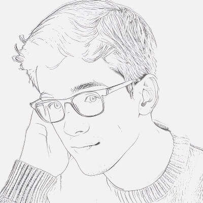 A Boy with Glasses Lost in Thought Reflecting Youthful